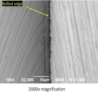 Figure 4 showing a surgical blade edge with a rolled edge.